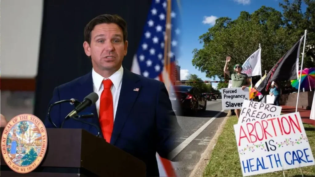 Hombre hablando en podio, manifestantes con pancartas