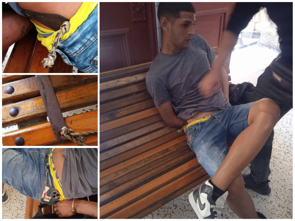 Hombre sentado con esposas en banco deteriorado