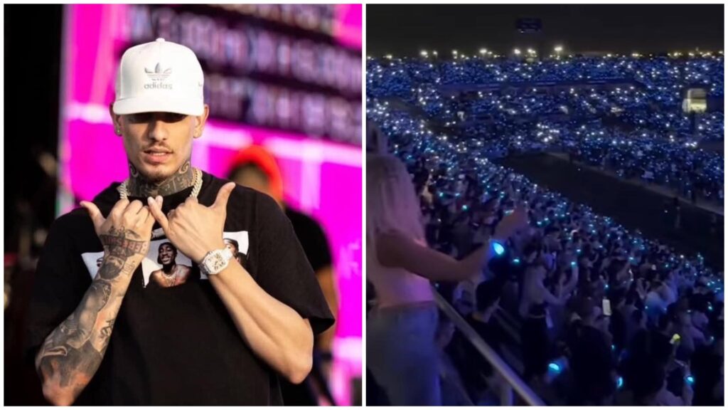 Hombre señala tatuajes, concierto multitud con luces.