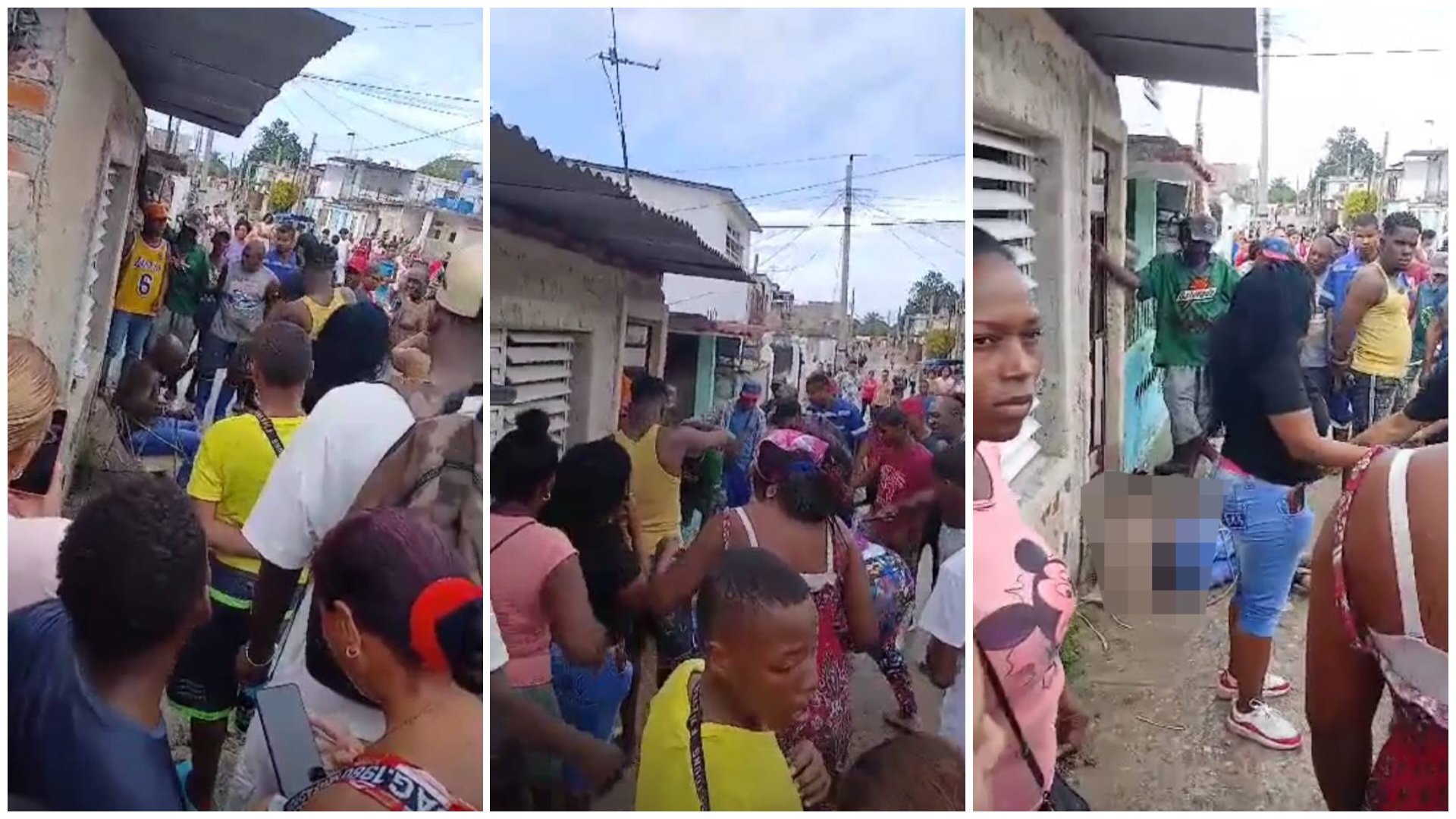 Muchedumbre reunida en calle de barrio urbano