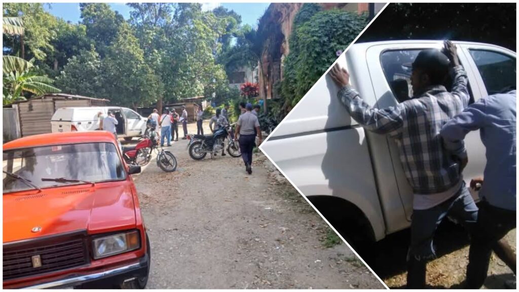 Personas congregadas y empujando un coche blanco.
