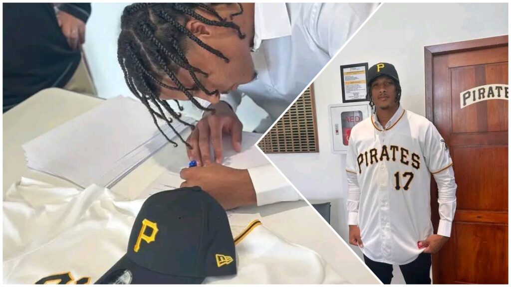 Jugador firmando contrato y vistiendo uniforme de béisbol
