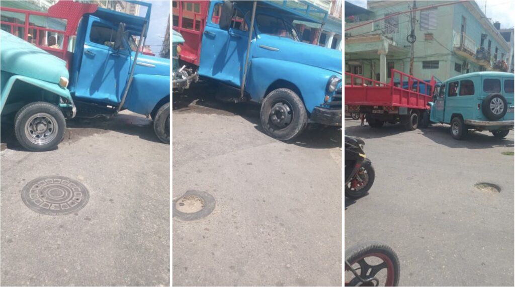 Accidente de tráfico entre camionetas en intersección.