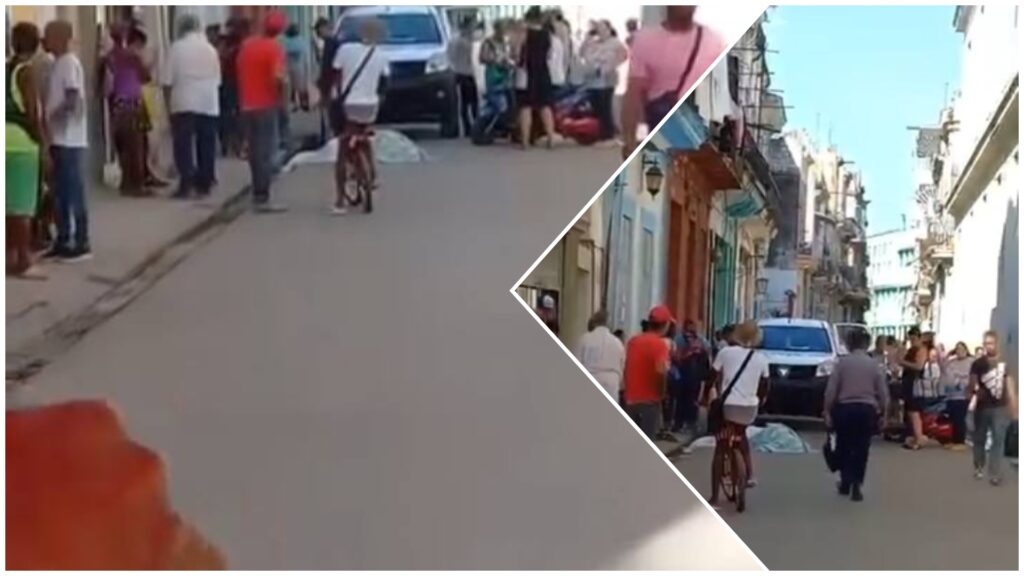 Gente reunida en calle con vehículo y bicicletas.