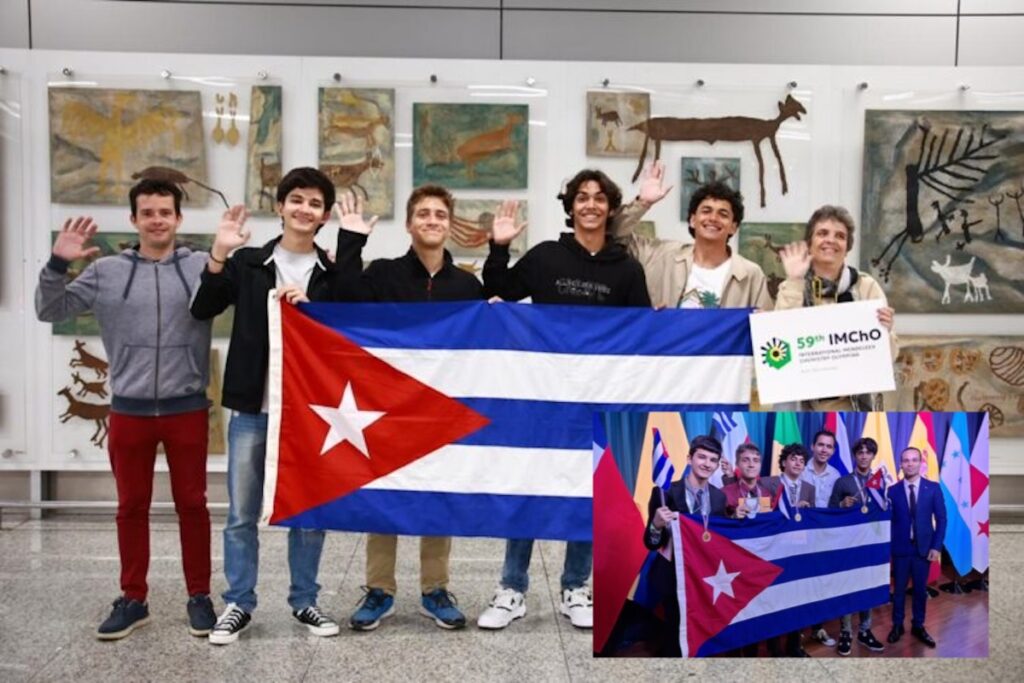 Grupo con bandera cubana en evento matemático.