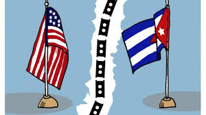 Banderas de EE.UU. y Cuba separadas por línea divisoria.