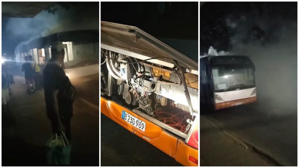 Autobús con humo y motor expuesto por fallo