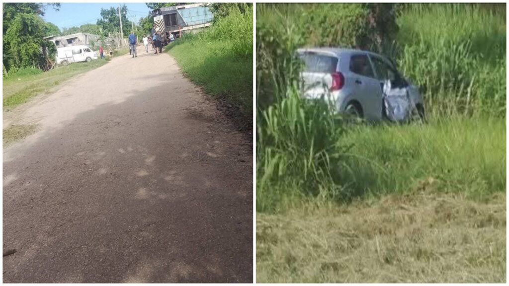 Camino rural y coche accidentado en pasto.